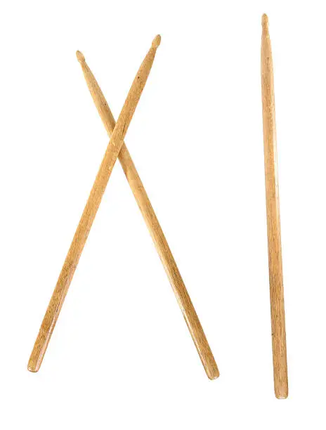 Crossed wooden drumsticks and single drumstick isolated for easy design.