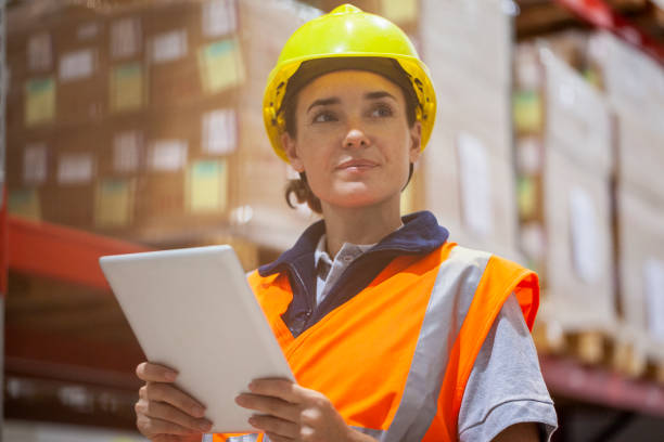 istock Female storage packer checking inventory with digital tablet in storage facility 1754242946
