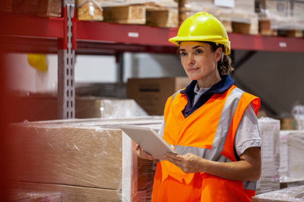 istock Female storage worker inspecting products inside warehouse facility 1754243498