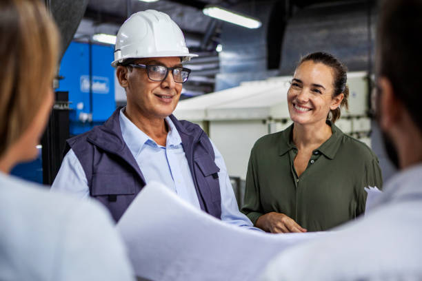 istock Warehouse manager discussing business matters with female supervisor 1754248587