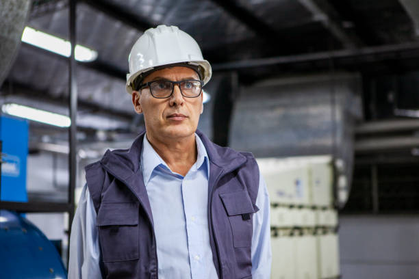 istock Male warehouse worker standing inside industrial facility 1754248616