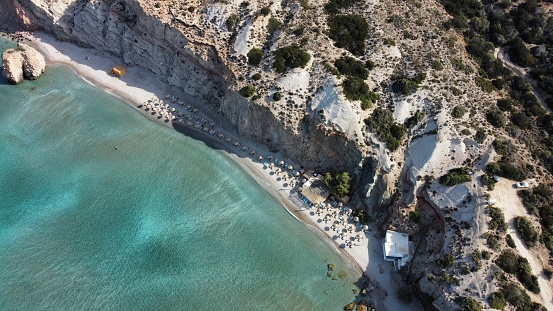 Firiplaka Beach is the second-most popular beach in Milos, renowned for its long stretch of glistening white sand, milky blue waters, and rocky outcrops.