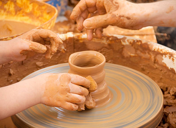 Artist pottery working on ceramic vases
