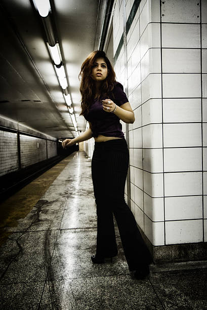istock Young Woman Waiting For A Train 175425496