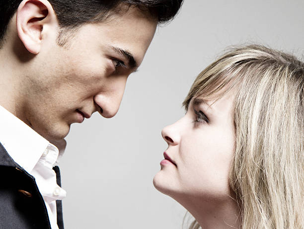 istock Profile Man and Woman Looking At Each Other 175425667