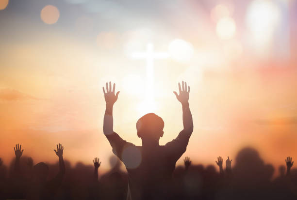 istock Silhouette christian reaching hands over blurred cross sunset background 1754256810