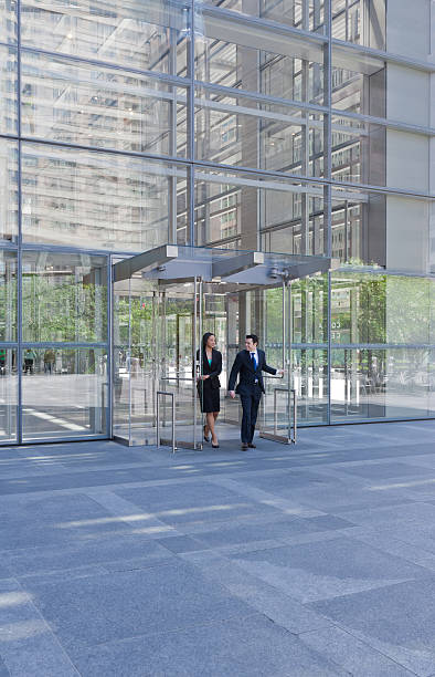 istock Business people exiting through glass doors 175425719