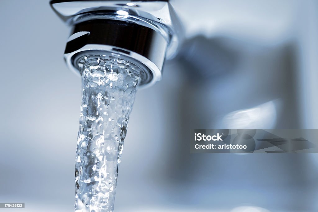 Running Water Faucet Faucet close-up with running water. Faucet Stock Photo