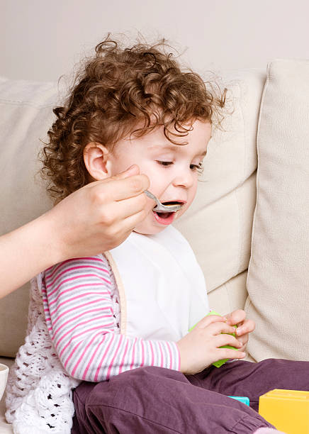 istock Mother feeding her baby 175426282