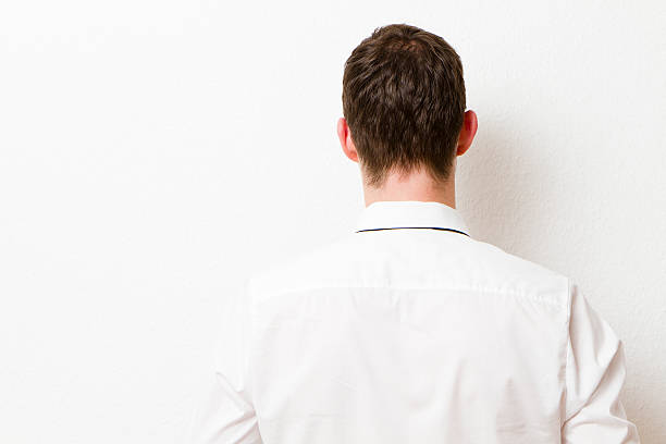 istock Back of Businessman against a Wall. 175426663