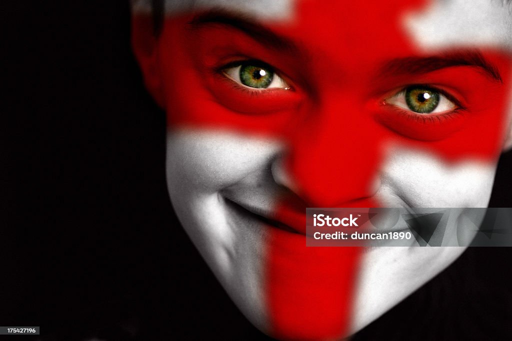 England football fan "Portrait of a happy young England football / soccer fan.  With a crazy expression on his face, and painted with the flag of Saint George." Adolescence Stock Photo