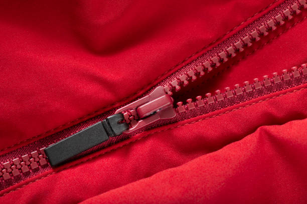 istock Close-up of a zipper with red clothes. 1754272556