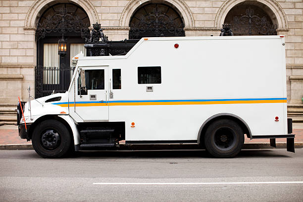 Armored Truck at Bank Armored Truck at a Bank. armored vehicle photos stock pictures, royalty-free photos & images
