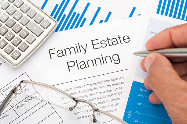 Family Estate planning document with writing hand Close up of a Family Estate planning document with writing hand probate law stock pictures, royalty-free photos & images