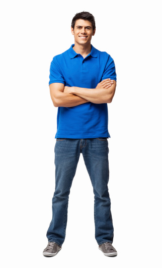 Full length portrait of young man in casual wear standing with arms crossed. Vertical shot. Isolated on white.