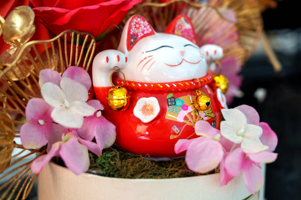 istock Maneki neko cat waving with paw close up 1754284551