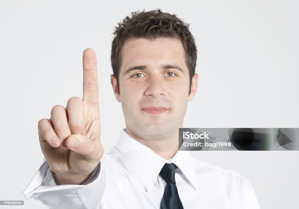 Businessman giving hand symbol Businessman touching screen Number 1 Stock Photo