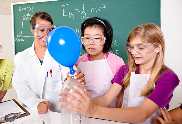 istock Students in biology lab mixing chemicals 175428951
