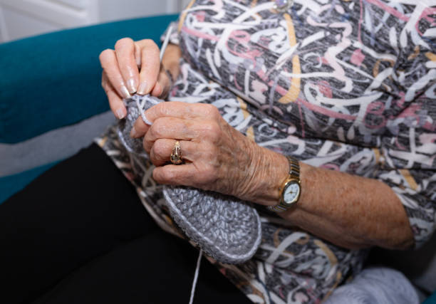 istock Grandmother knitting wool slipper 1754292258