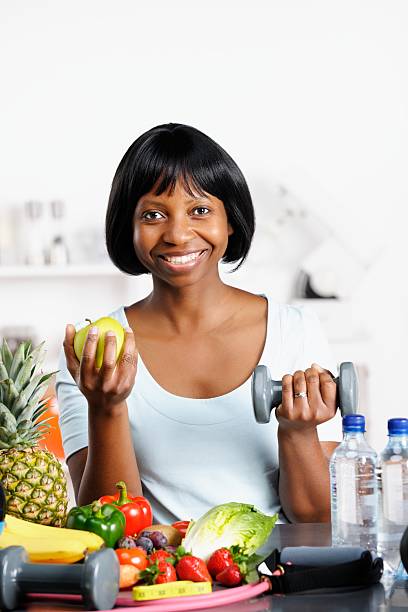 istock Happy Woman Balancing A Healthy Diet And Exercise 175429487