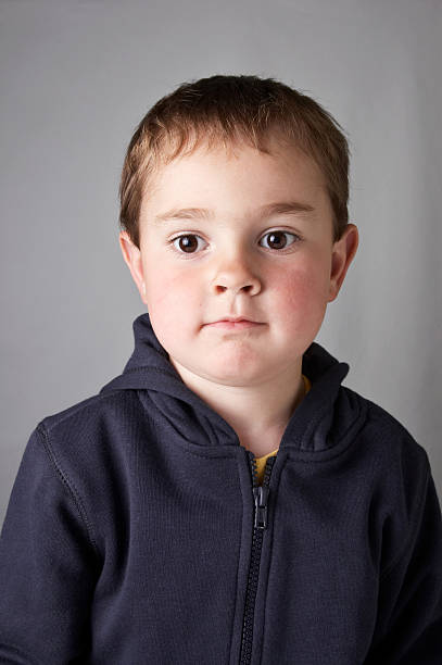 istock Four year old boy hoodie curious look 175429539