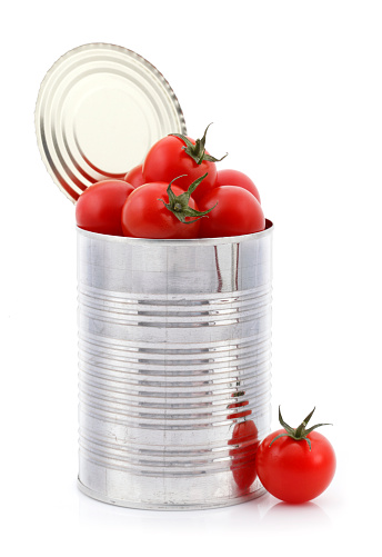 Open tin can with fresh tomatoes.