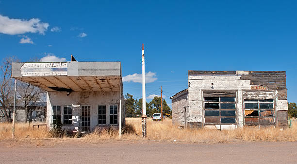 Abandoned Gas Station and Garage in Ghost Town, New Mexico Abandoned gas station and a garage in ghost town of New Mexico ghost town stock pictures, royalty-free photos & images