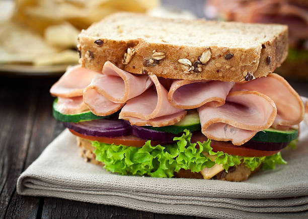 Ham and Cheese Sandwich Ham and Cheese Sandwich with Lettuce,Cucumber and red onion Deli Turkey stock pictures, royalty-free photos & images