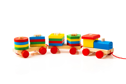 Wooden colorful toy train isolated on white background