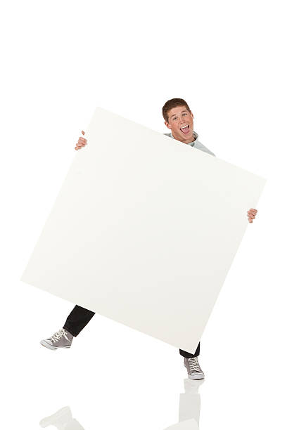 istock Attractive young man holding a placard 175430993