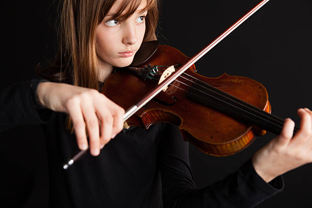 istock Portrait of young violinist with old and valuable violin.. 175431576