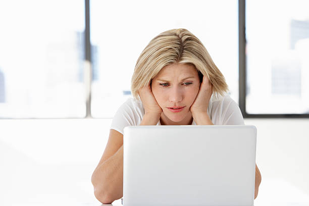 istock Frustrated Businesswoman Sitting At Desk In Office Using Laptop 175431881