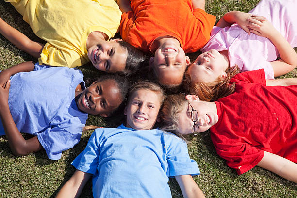 istock Girls lying in a circle looking up 175432189