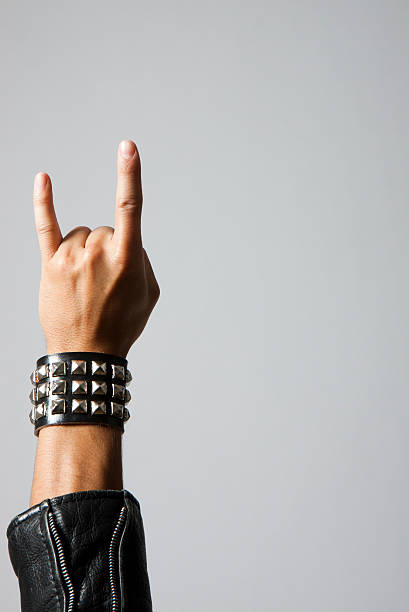 Rock on Man holding up rock symbol. Copyspace. punk music stock pictures, royalty-free photos & images