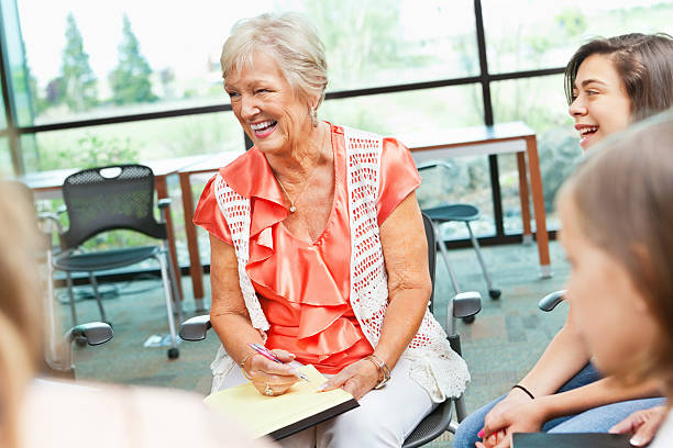 istock Adult woman laughing in a meeting 175432970