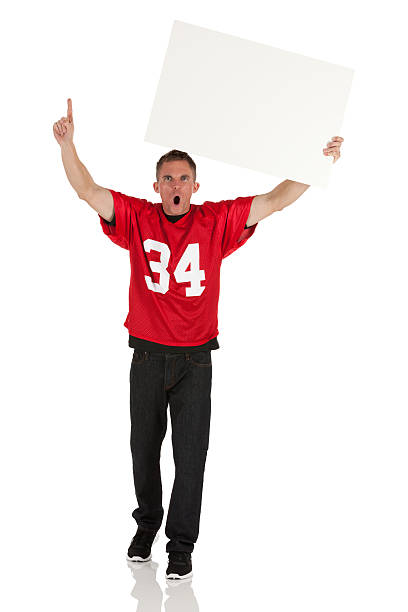 istock Sports fan holding a placard and cheering 175433270