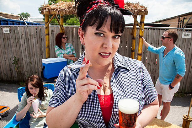 istock woman drinking smoking at bacyard barbecure party 175433693