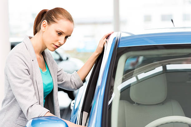 istock Woman Looking At Car 175433738