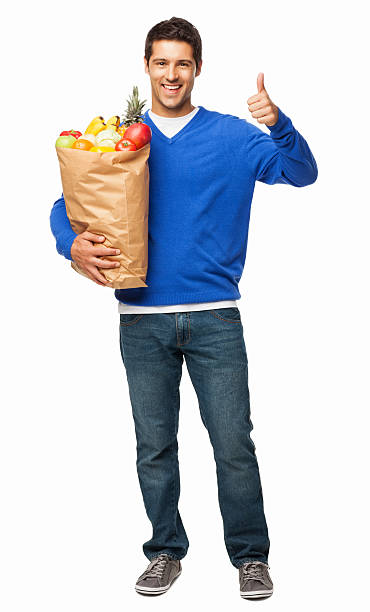 istock Man Gesturing Thumbs Up While Carrying Bag Of Groceries-Isolated 175433833