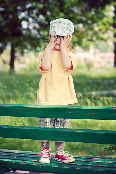 istock Little Boy Playing Hide And Seek Outdoors 175433836
