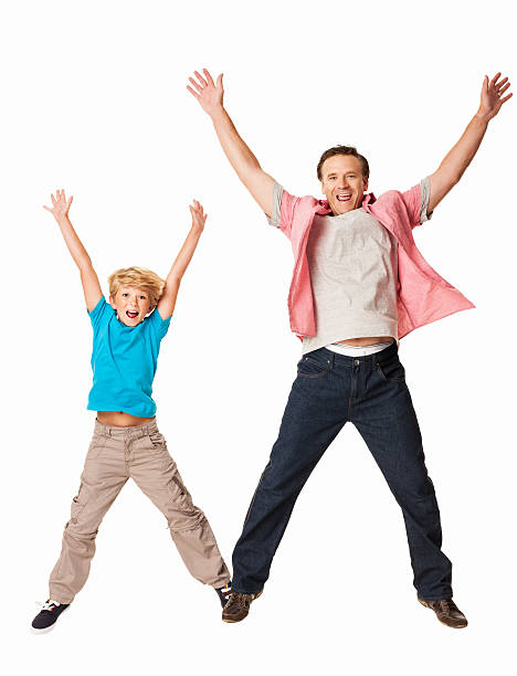 istock Excited Father And Son Jumping Together - Isolated 175433898
