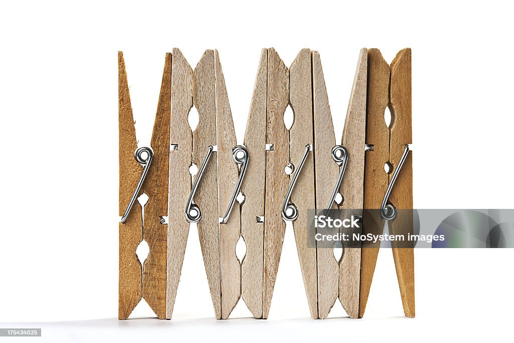 Six wood clothespins isolated Six wood clothespins isolated on white background with shadow Close-up Stock Photo