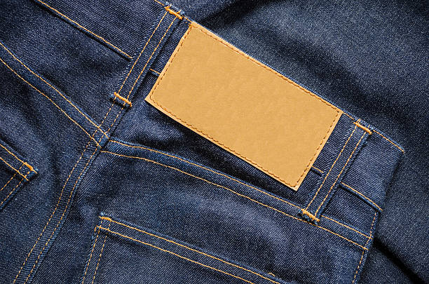 Blue Jeans with Blank leather label Highly detailed closeup of  Blue Jeans leather pocket clothing hide stock pictures, royalty-free photos & images