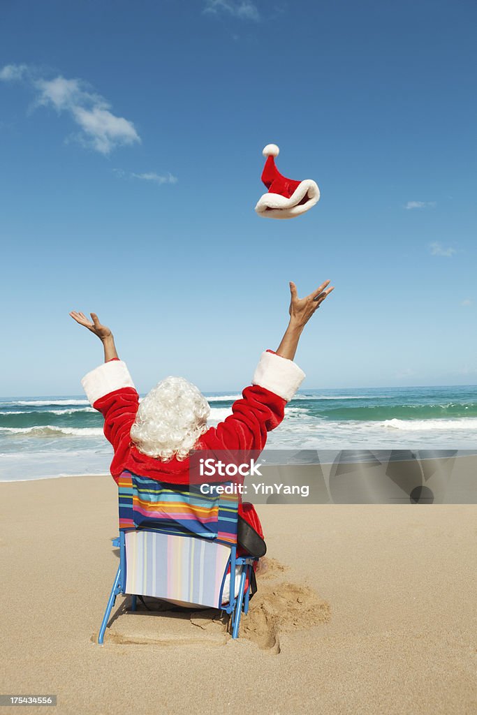Happy Christmas Santa Claus on Tropical Beach Vacation Vt Subject: Santa Claus tropical beach vacation after the Christmas holiday, resting and relaxing as a tourist.  Santa Claus Stock Photo