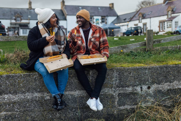 istock Enjoying Fish and Chips at the Coast 1754347252