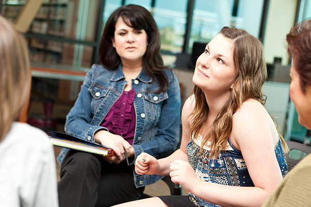 istock Pondering teenager in a group discussion setting 175435219