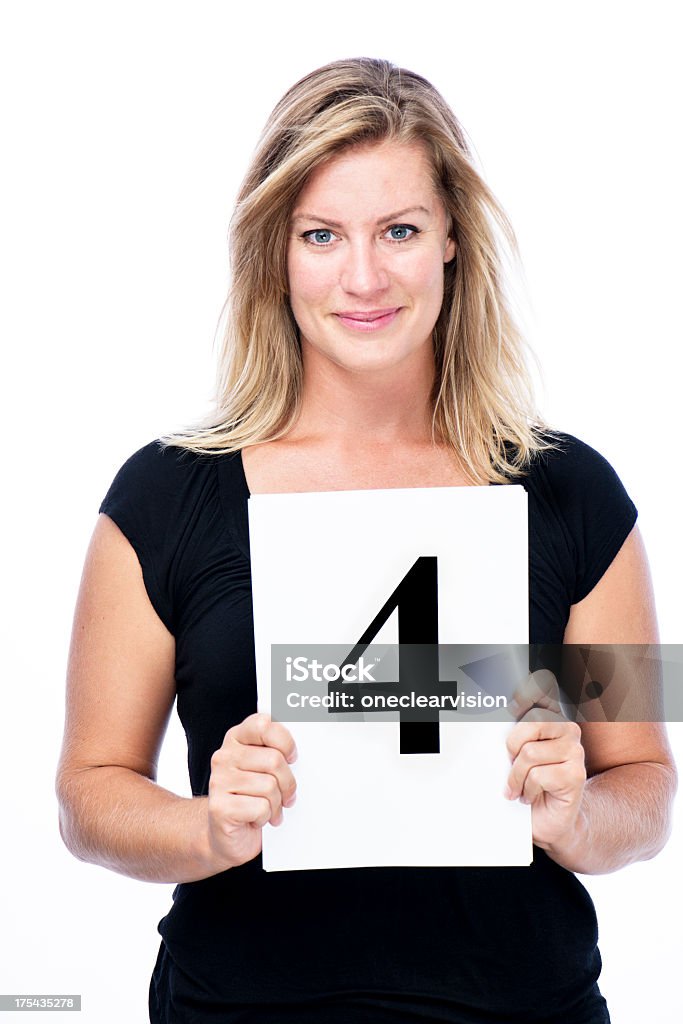 Four Woman Woman holding number 4. Adult Stock Photo