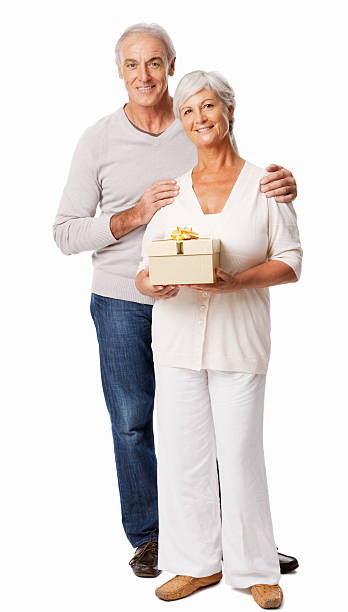 istock Senior Woman Holding a Gift - Isolated 175435438