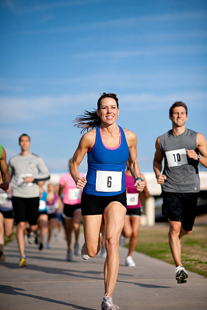 Runners Competitive runners in a cross country race. marathon stock pictures, royalty-free photos & images