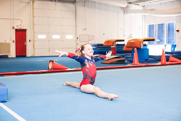 Young Gymnast Doing Floor Routine stock photo